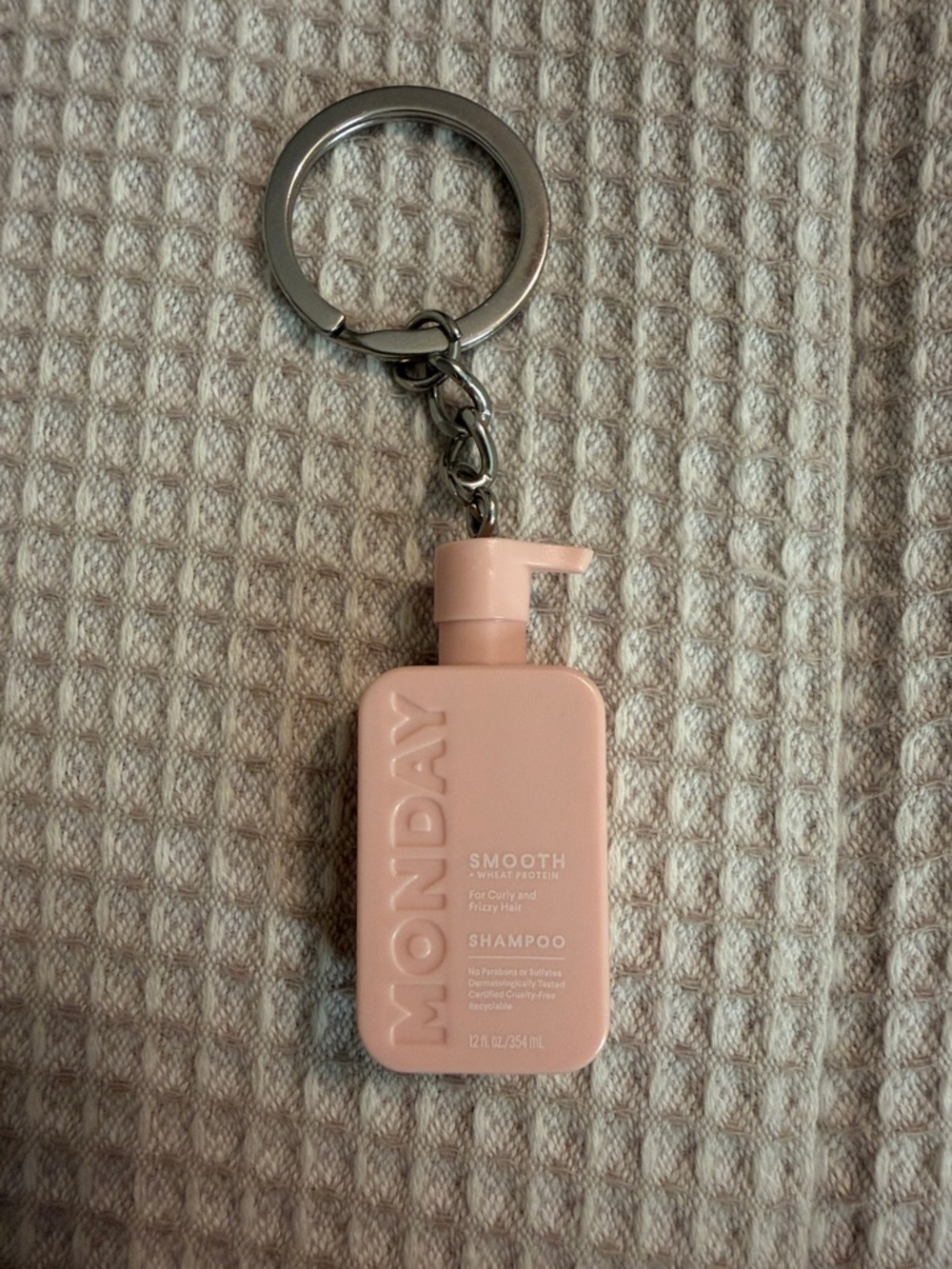Monday mini shampoo keychain